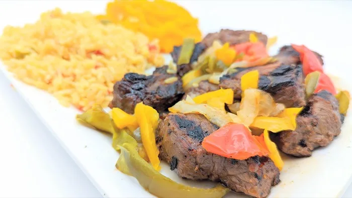 Grilled steak tips with seasoned rice at Venus III